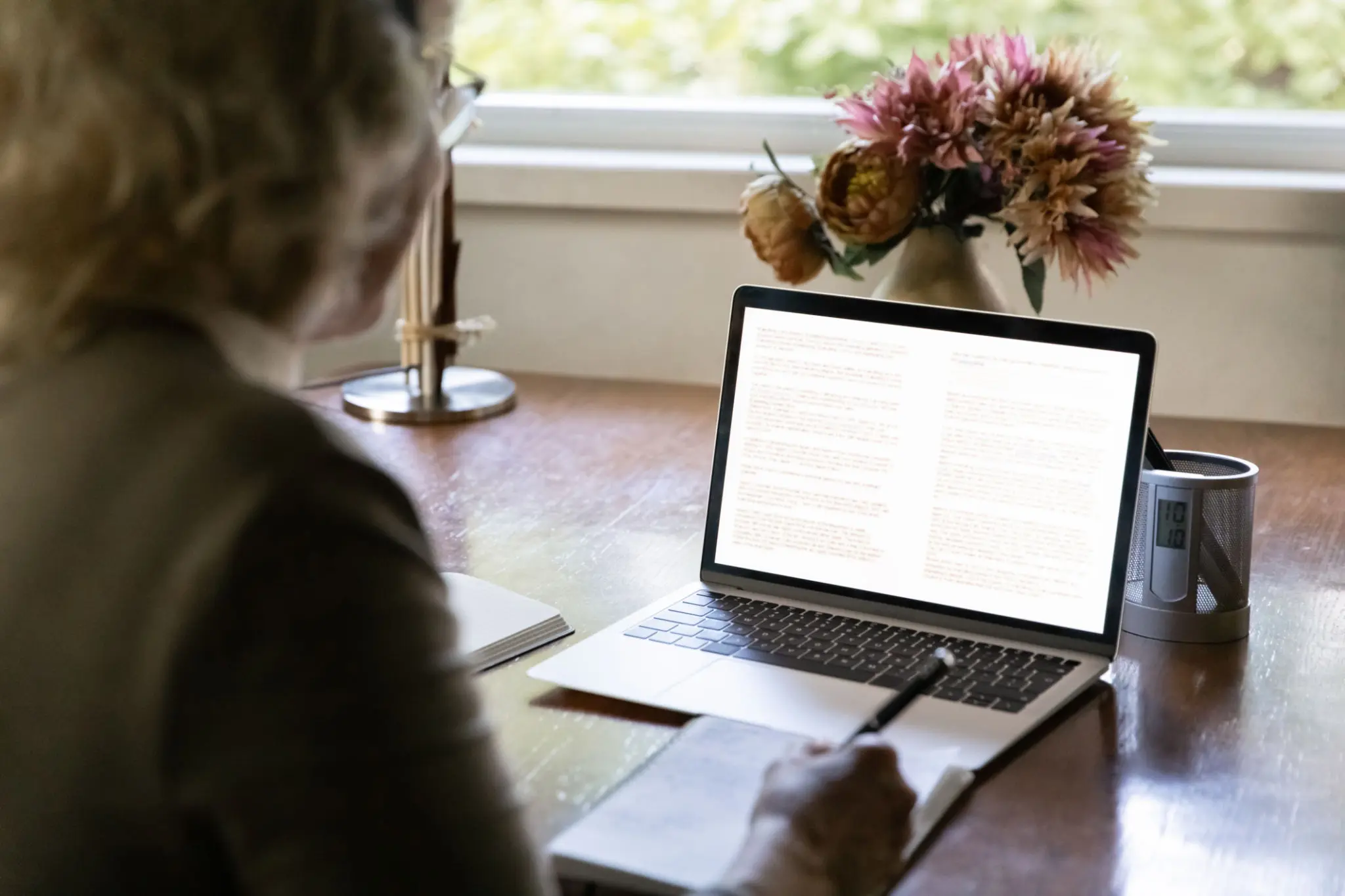 Woman working on laptop at home